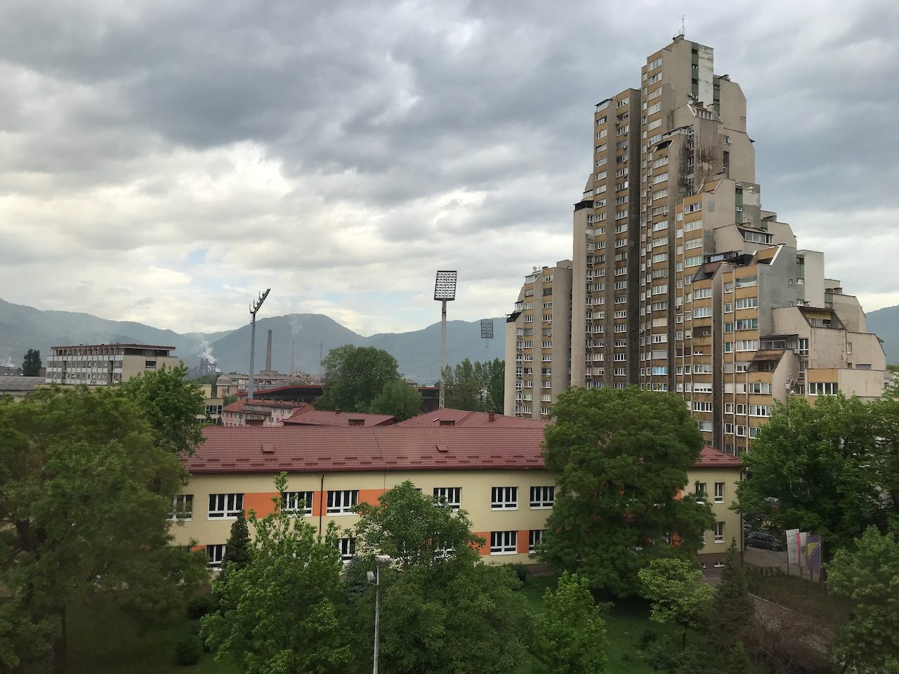 A Bosnian city of apartment blocks and minarets in a green river valley